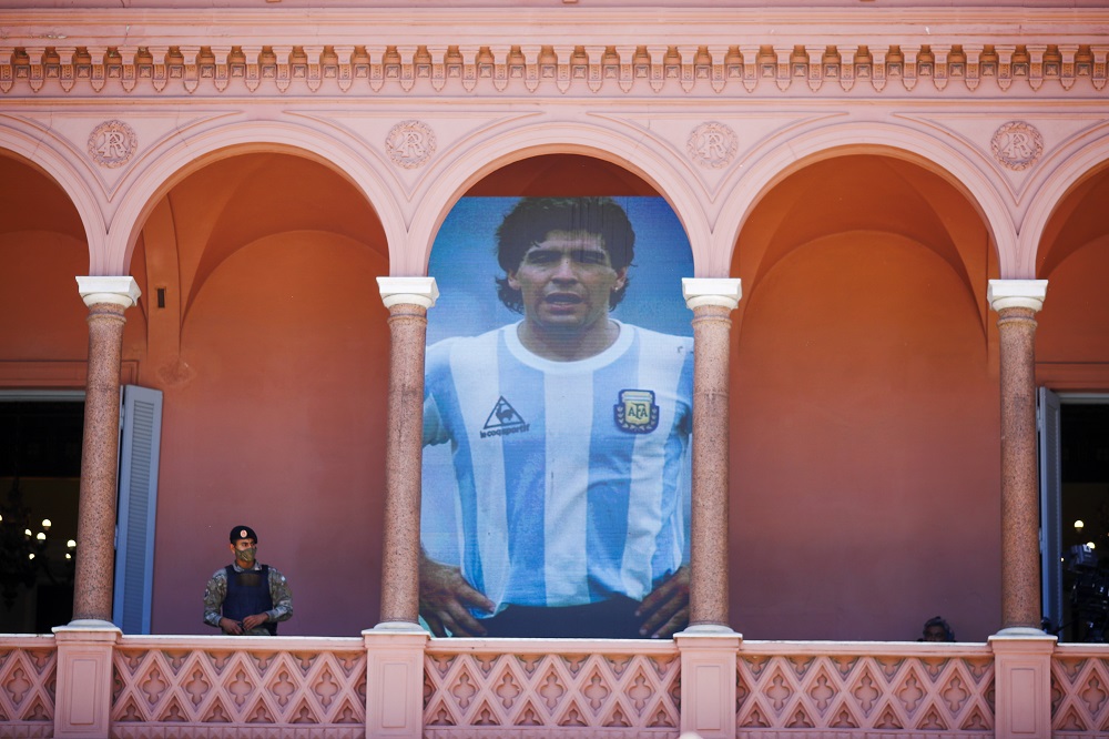 Guard next to Maradona's poster