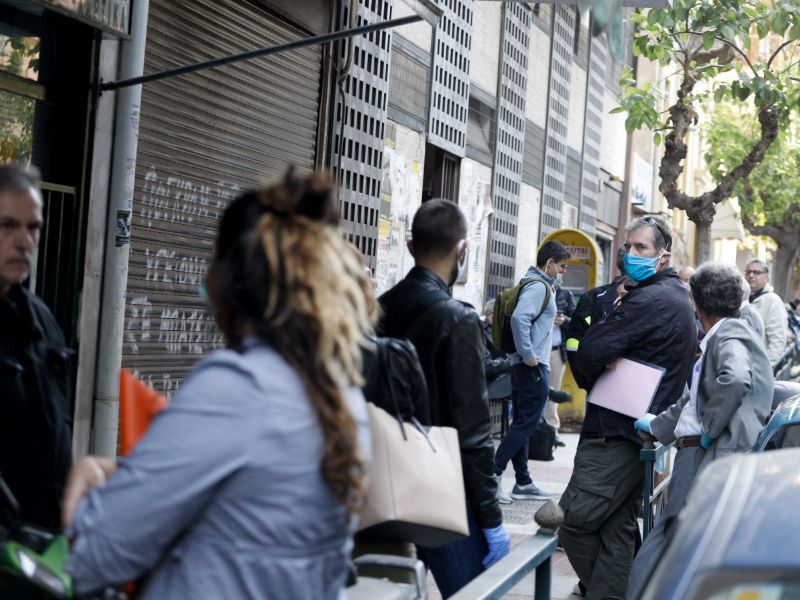 Some with masks, others without rushing to carry out their affairs in the mortgage office.