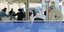 Ειδικοί με στολές και μάσκες σε κέντρο διεξαγωγής ελέγχων για τον κορωνοϊό στη Νότια Κορέα
